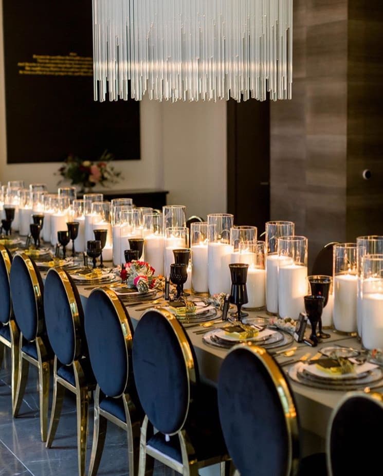 Clusters of pillar candles styled for an intimate celebration