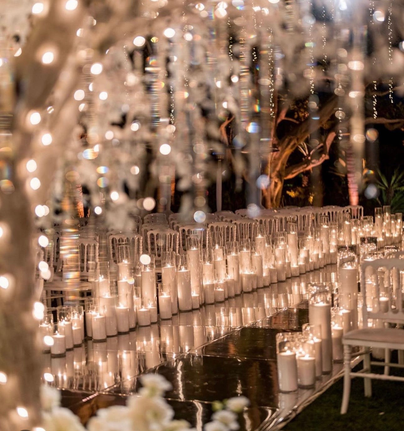 Intimate candlelit walkway glowing for a private celebration